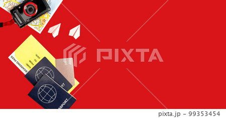 Banner with travel by couple or family trip essentials on red background. Two passports, boarding pass, credit card, tourist map, point and shoot camera, origami planes. Copy space. 99353454