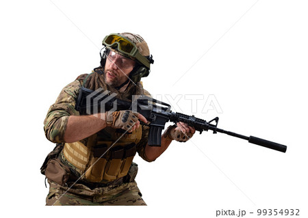 Mercenary soldier with an automatic rifle looking to the side, controlling his sector of fire during the withdrawal of his group. Mercenary soldier with an automatic rifle looking to the side, controlling his sector of fire during the withdrawal of his group. 99354932