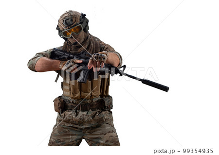 Special Mercenary soldie during a special operation walks with an automatic rifle and looking at camera. Special Mercenary soldie during a special operation walks with an automatic rifle and looking at camera. 99354935