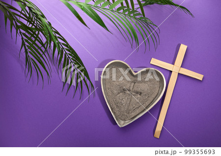 Ash Wednesday, Lent Season and Holy Week concept. Christian crosses and ashes on purple background. Ash Wednesday, Lent Season and Holy Week concept. Christian crosses and ashes on purple background. 99355693