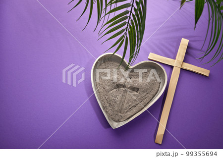 Ash Wednesday, Lent Season and Holy Week concept. Christian crosses and ashes on purple background. Ash Wednesday, Lent Season and Holy Week concept. Christian crosses and ashes on purple background. 99355694