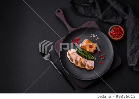 Delicious chicken or pork meat roll with mushrooms, cheese, spices and herbs Delicious chicken or pork meat roll with mushrooms, cheese, spices and herbs 99356615