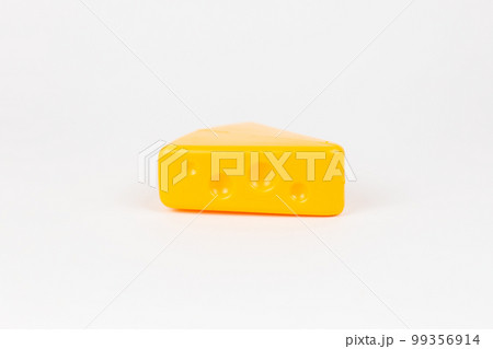 toy plastic piece of masdam cheese on a white background 99356914