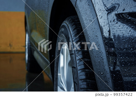 Beautiful brand new Hyundai Tucson close up view on the parking space. Beautiful brand new Hyundai Tucson close up view on the parking space. 99357422