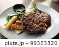 beef steaks meat with vegetables on a plate  99363320