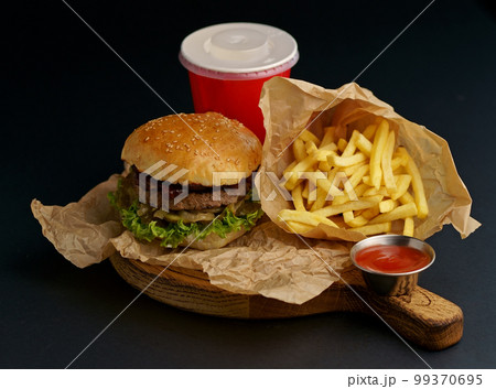 fresh tasty burger and french fries on woodenの写真素材