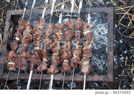 meat pork and beef skewers on the grill 99374993