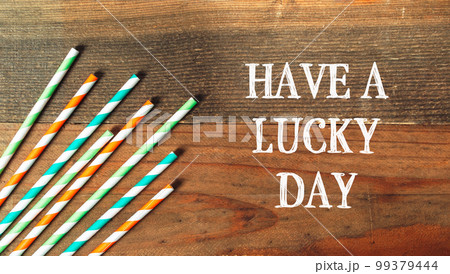 Have A Lucky Day on a wooden background 99379444