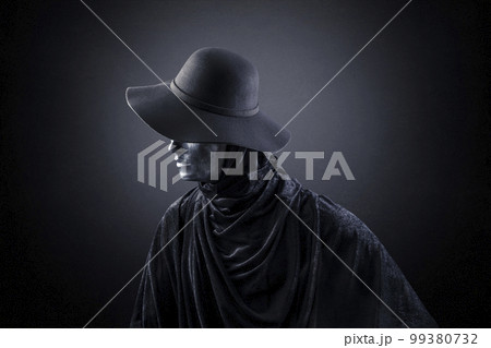 Scary lady with old hat in the dark Scary lady with old hat in the dark 99380732