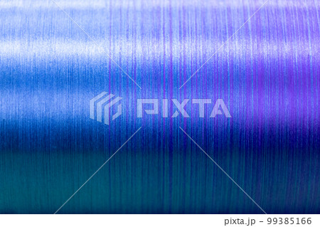 Closed up of blue and violet color of thread textured background (Focus at center of picture) Closed up of blue and violet color of thread textured background (Focus at center of picture) 99385166