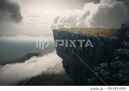 突き出した崖の端と雲海 99385489