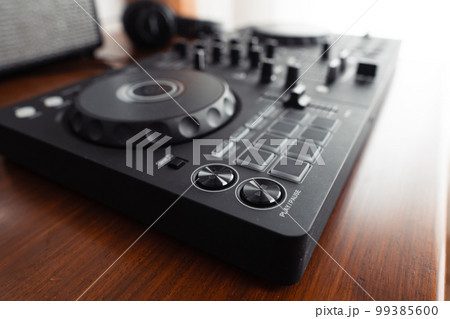 dj controller,DJ Spinning, Mixing, and Scratching in house dj controller,DJ Spinning, Mixing, and Scratching in house 99385600