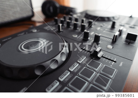 dj controller,DJ Spinning, Mixing, and Scratching in house dj controller,DJ Spinning, Mixing, and Scratching in house 99385601