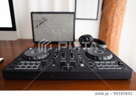 dj controller,DJ Spinning, Mixing, and Scratching in house dj controller,DJ Spinning, Mixing, and Scratching in house 99385602