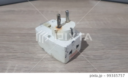 Burnout electrical appliances or electrical plug or electrical adapter dangerous Burnout electrical appliances or electrical plug or electrical adapter dangerous 99385757