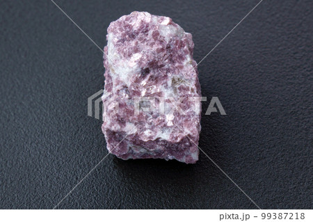 Mineral stone lepidolite. Macro shooting of natural gemstone. The raw mineral. Mineral stone lepidolite. Macro shooting of natural gemstone. The raw mineral. 99387218