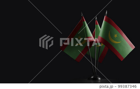 Small national flags of the Mauritania on a black background Small national flags of the Mauritania on a black background 99387346