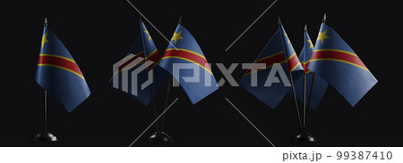 Small national flags of the Democratic Republic of the Congo on a black background 99387410
