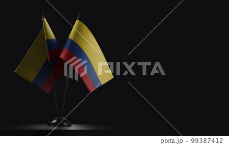 Small national flags of the Colombia on a black background 99387412