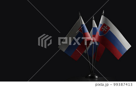 Small national flags of the Slovakia on a black background 99387413