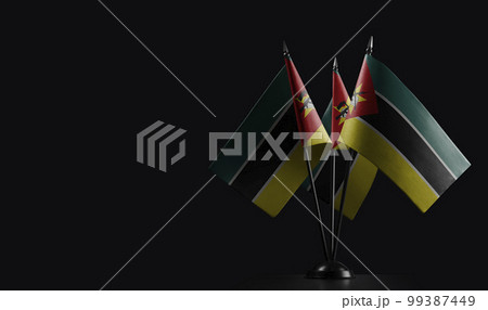 Small national flags of the Mozambique on a black background Small national flags of the Mozambique on a black background 99387449