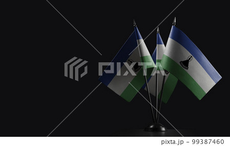 Small national flags of the Lesotho on a black background Small national flags of the Lesotho on a black background 99387460