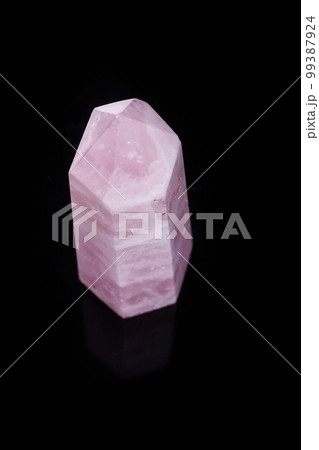 Macro mineral pink quartz crystal on a black background Macro mineral pink quartz crystal on a black background 99387924