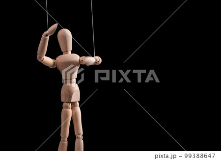 Banner with puppet on strings. Manipulation, control, abusive relationship or addiction concept. Marionette in human hand. Copy space 99388647