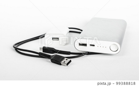 Portable phone charger, cable, USB plug, wire, cord. Travel kit for smartphone charging Portable phone charger, cable, USB plug, wire, cord. Travel kit for smartphone charging 99388818