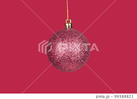Christmas ball, bauble, sphere ornament of viva magenta color. Monochrome Xmas image with holiday ornament 99388821