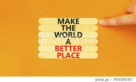 Make a better world symbol. Concept words Make the world a better place on wooden stick. Beautiful orange table orange background. Businessman hand. Business make a better world concept. Copy space. Make a better world symbol. Concept words Make the world a better place on wooden stick. Beautiful orange table orange background. Businessman hand. Business make a better world concept. Copy space. 99389593