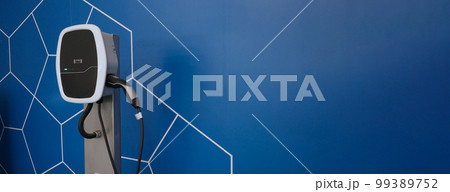 EV Charger quick charge type at car parking which DC Charging faster than AC system. EV Charger car station charging use AC socket plug for electric engine vehicle. Future transport energy technology 99389752