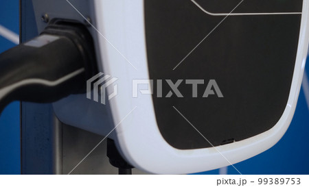 EV Charger quick charge type at car parking which DC Charging faster than AC system. EV Charger car station charging use AC socket plug for electric engine vehicle. Future transport energy technology 99389753