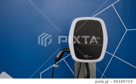 EV Charger quick charge type at car parking which DC Charging faster than AC system. EV Charger car station charging use AC socket plug for electric engine vehicle. Future transport energy technology 99389759