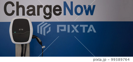 EV Charger quick charge type at car parking which DC Charging faster than AC system. EV Charger car station charging use AC socket plug for electric engine vehicle. Future transport energy technology 99389764