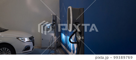 EV Charger quick charge type at car parking which DC Charging faster than AC system. EV Charger car station charging use AC socket plug for electric engine vehicle. Future transport energy technology 99389769