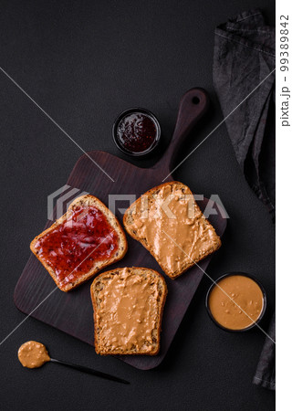 Nutritious sandwiches consisting of bread, raspberry jam and peanut butter Nutritious sandwiches consisting of bread, raspberry jam and peanut butter 99389842