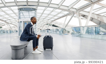 Transportation Concept. Young Black Businessman With Suitcase Waiting For Flight At Airport 99390421