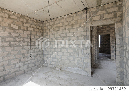 Construction of an individual residential building, wall view with a doorway Construction of an individual residential building, wall view with a doorway 99391829