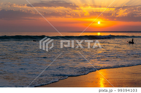 Ocean landscape with cloudy sky at sunset Ocean landscape with cloudy sky at sunset 99394103