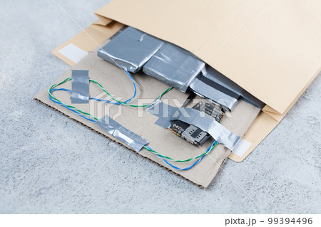 Mail bomb IED - Improvised Explosive Device with c4 and cell phone module in envelope Mail bomb IED - Improvised Explosive Device with c4 and cell phone module in envelope 99394496
