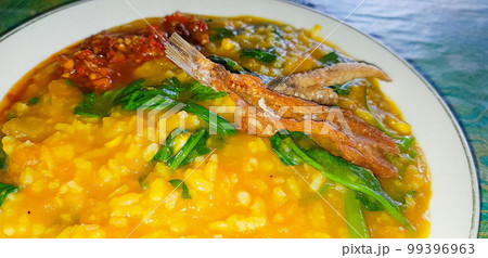 tinutuan, bubur manado, indonesian traditional porridge dish mixed of rice, pumpkin, and kangkung vegetable tinutuan, bubur manado, indonesian traditional porridge dish mixed of rice, pumpkin, and kangkung vegetable 99396963
