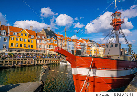Copenhagen city skyline in Denmark at famous old Nyhavn port Copenhagen city skyline in Denmark at famous old Nyhavn port 99397643