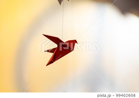 Japanese folded Origami cranes hanging on with strings. Hundreds handmade paper birds isolated with copy space. 1000 thousand crane sculpture topic. Symbol of peace, faith, health, wishes, hope Japanese folded Origami cranes hanging on with strings. Hundreds handmade paper birds isolated with copy space. 1000 thousand crane sculpture topic. Symbol of peace, faith, health, wishes, hope 99402608