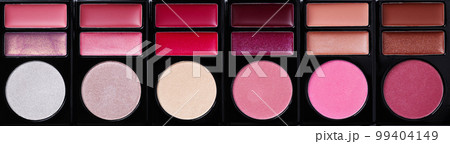 Multi-colored eye shadow palette top view. Abstract background of eye shadows. Multi-colored eye shadow palette top view. Abstract background of eye shadows. 99404149