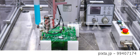 Technological process of soldering and assembly chip components on pcb board. Automated soldering machine inside at industrial 99407174