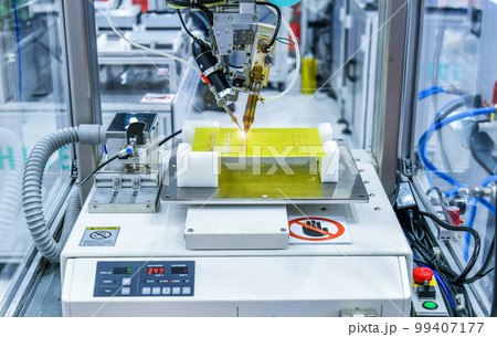Technological process of soldering and assembly chip components on pcb board. Automated soldering machine inside at industrial Technological process of soldering and assembly chip components on pcb board. Automated soldering machine inside at industrial 99407177