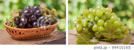 Blue grapes in a wicker basket on wooden table with blurred background 99410168