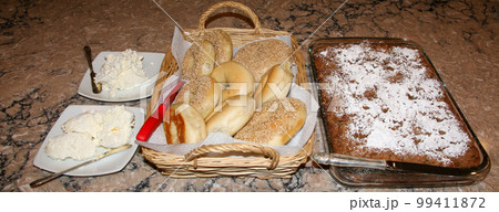 Bagels and coffee cack set up for brunch on a kitchen counter Bagels and coffee cack set up for brunch on a kitchen counter 99411872
