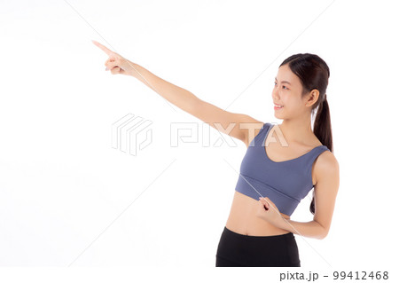 Portrait of beautiful young asian woman in sportwear smile and presenting isolated. Portrait of beautiful young asian woman in sportwear smile and presenting isolated. 99412468